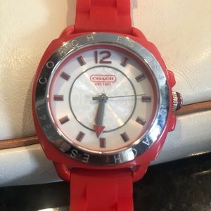 Women’s Coach red rubber trap watch.